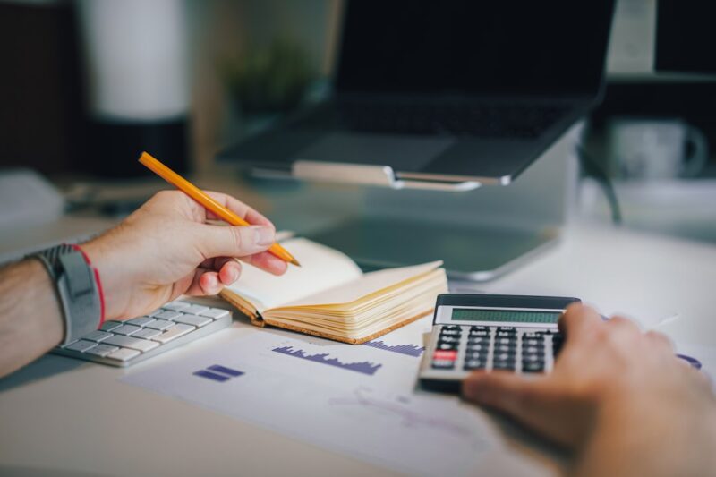 Currencies and finance. Stock exchange. Calculator on the table